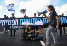 Families leave Gaza City after night of bombardment, Israelis protest